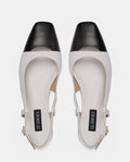 zapatos blancos old money para mujer con puntera negra