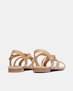 par de sandalias nude de tiras y tacón plano