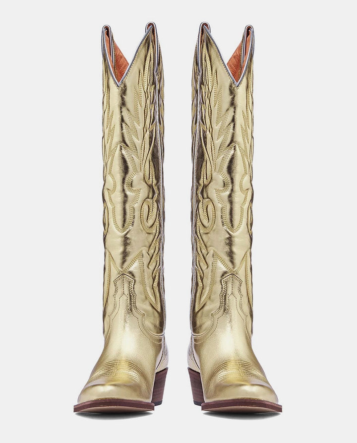 Delantera botas cowboy doradas metalizadas mujer