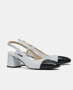 sandalias de piel blanca con tacón midi y punta negra